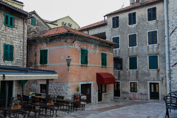 Fototapeta premium Kotor's narrow cobblestone streets and historic stone houses, a UNESCO World Heritage site. City ​​architecture details. 