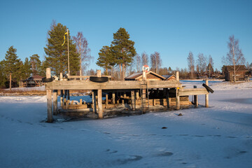 Winter landscape with a wooden dock in Leksand, Dalarna, Sweden