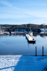 Winter serenity by the waterfront in Leksand, Dalarna, Sweden during a snowy day