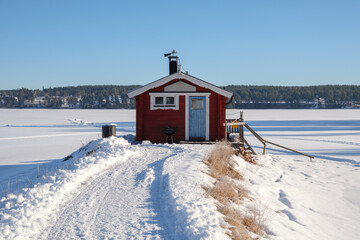 Winter retreat by the frozen lake in Västanvik, Dalarna, Sweden