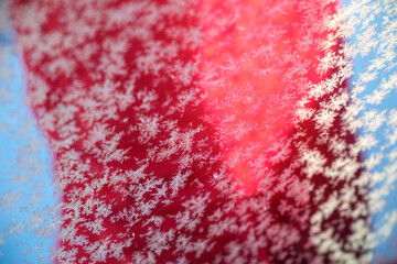 Detailed close-up of intricate snowflakes on a vibrant background in Västanvik, Dalarna, Sweden