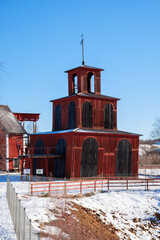 Historic wooden structure of Falun Mine in winter landscape of Dalarna, Sweden