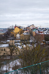 Snow-covered rooftops of Stockholm showcase winter charm and urban landscape