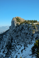 Snow-covered mountain peak in Fischbachau, Bavaria during a clear winter day