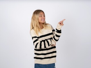 Photo of attractive Beautiful teen girl wearing striped sweater direct finger empty space cheap...