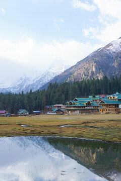 Snowy Nanga Parbat reflects perfectly in a calm lake at Fairy Meadows, Pakistan. 