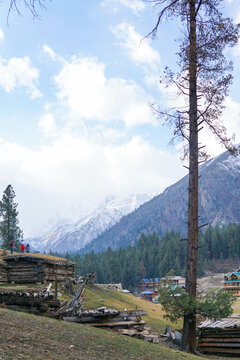 Snowy Nanga Parbat reflects perfectly in a calm lake at Fairy Meadows, Pakistan. 