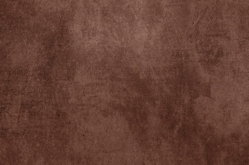 Velvety fabric texture with distressed details in Pantone 2025 Mocha Mousse color.