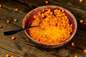 crushed sea buckthorn berries in a bowl