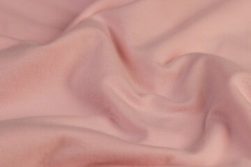 details of a part of the pink fabric that is used to make clothes