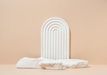 Minimalist Product Display with Textured Stones and White Arch on Beige Background. Studio...