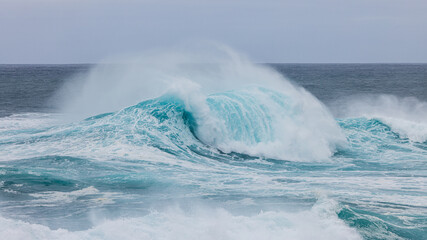 Big wave breaking in the Atlantic ocean off the coast of the isle of Sao Miguel, Azores Portugal