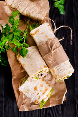 Shawarma sandwich, fresh roll of lavash (pita bread) pork shawarma with ham and cheese
