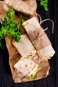 Shawarma sandwich, fresh roll of lavash (pita bread) pork shawarma with ham and cheese
