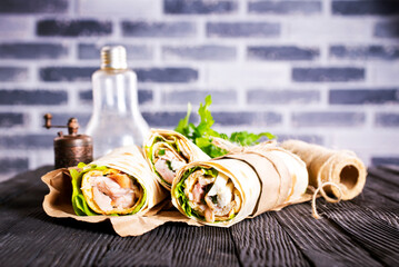 Shawarma sandwich, fresh roll of lavash (pita bread) pork shawarma with ham and cheese