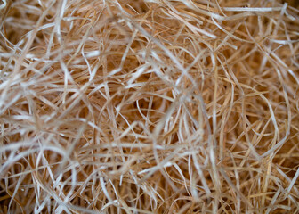 Obraz premium Eco-friendly packaging concept. close-up of shredded paper inside a box for packaging goods from online stores and delivery. Trade and environmental impact.