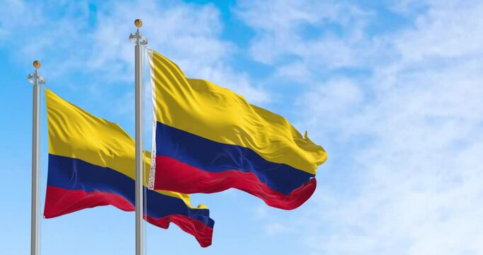 Colombia national flags waving in the wind on a clear day