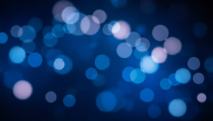Glowing bokeh lights in warm tones scattered across a deep blue background, creating a dreamy and festive effect.