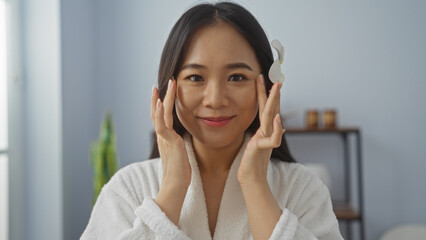 Beautiful young asian woman enjoying wellness treatment at an indoor spa with a relaxing ambiance