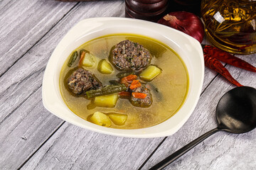 Soup with beef meatballs and vegetables