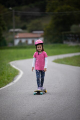 beautiful girl playing with her skateboard