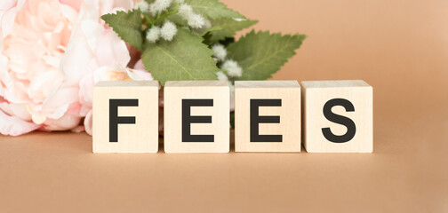 Cubes dice with fees on wooden background