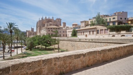 Fototapeta premium Blurred background of mallorca outdoor scene in spain with historic buildings and a clear blue sky