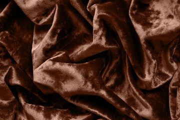 A rich mocha-brown crushed velvet texture fills the frame, embodying the warmth and luxury of Pantone's 2025 Color of the Year, "Mocha Mousse."