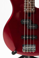 Closeup photo of a white bass guitar
