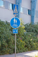Rule sign: Zebra crossing and combined bike path and sidewalk in Finland.