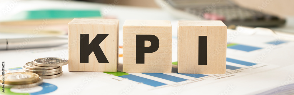 Poster acronym kpi - key performance indicator. wooden small cubes with letters isolated on white backgroun
