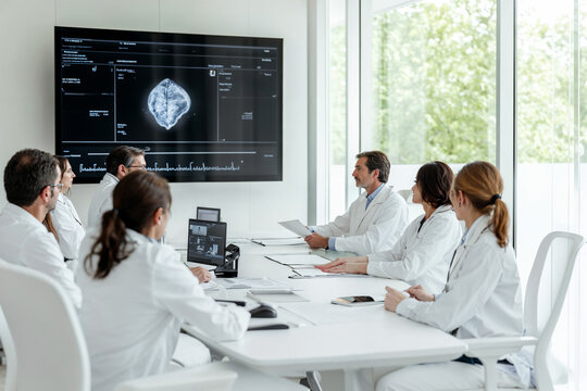 Medical team reviews patient data in AI-equipped room