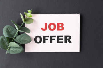 White card on the black background with text Job Offer