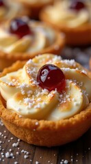 Delicious tartlet with creamy filling, adorned with a cherry and sprinkled with sugar, rests on a rustic wooden background