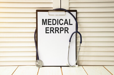 clipboard with medical error text on a sheet of paper on white background