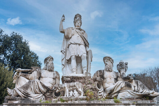 The Fountain of the Goddess Roma in Piazza del Popolo, built in 1823, flanked by 2 statues of the Tiber and Aniene rivers, at its foot, is the she-wolf nursing the twins Romulus and Remus. Rome, 2017
