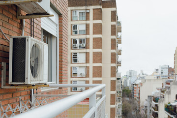 air conditioning compressor on a balcony of residential buildings, copy space.