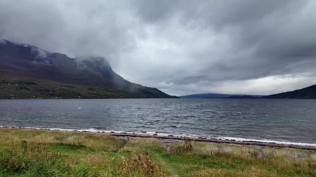 Langstranda Narvik beach with mountains and dark clouds in Norway