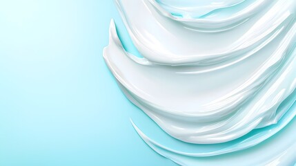 Fototapeta premium A blue background with a white cream product on it