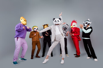 Full body portrait of zebra gorilla raccoon lion sloth rooster mask people show v-sign applaud...