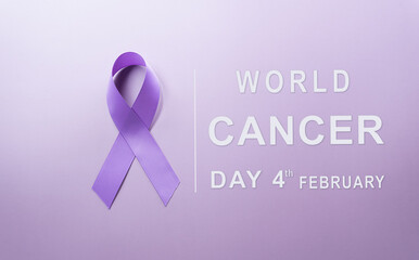 Purple ribbon on pastel paper background for supporting World Cancer Day campaign on February 4.