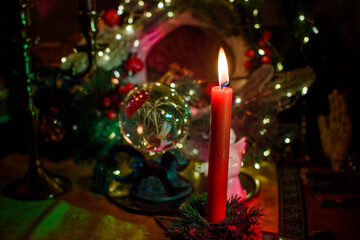 Rite with a burning candle, night mystery atmosphere, Christmas eve, Yule or another day