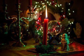 Rite with a burning candle, night mystery atmosphere, Christmas eve, Yule or another day