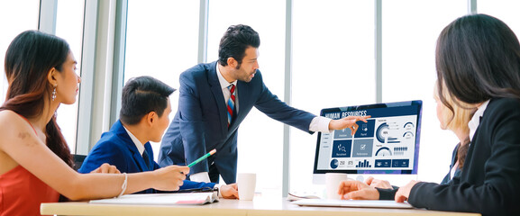 Human resources management software on computer screen helping human resources employee to manage...