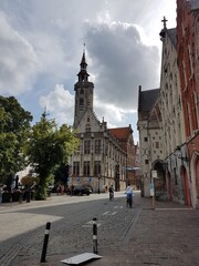 Obraz premium Tower and old buildings in Bruges, Belgium.