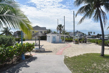 Fototapeta premium A cute colonial inspired hotel exterior design with pastel colours by the Caribbean sea in Bahamas