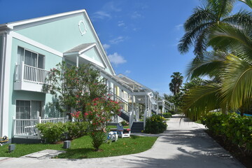 A cute colonial inspired hotel exterior design with pastel  colours by the Caribbean sea in Bahamas