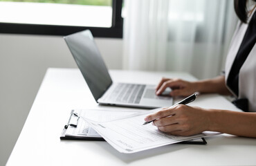 Business woman employer holding resume hiring recruit looking cv resume to hire candidates, analyzing information before job interview. Recruitment concepts