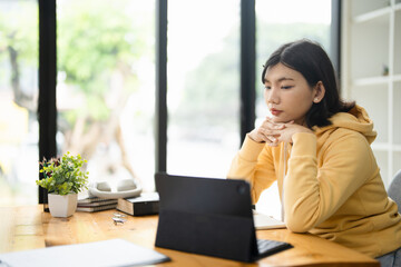 Fototapeta premium Asian girl student online learning class study online video call zoom teacher, Happy asian girl learn english language online with computer laptop.