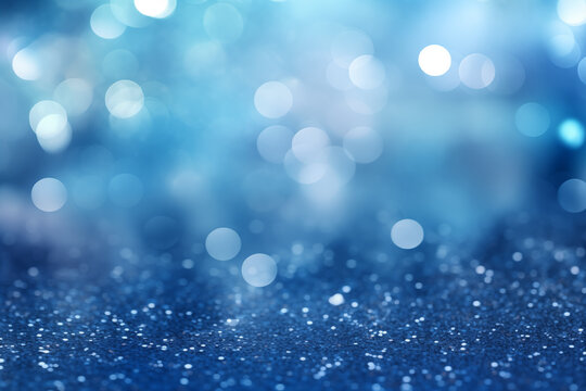 An abstract background in shimmering silver and blue tones, adorned with soft, glowing bokeh lights, for holiday greetings or celebratory designs.